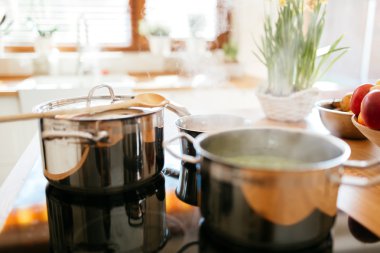 Lunch being made in modern kitchen clipart