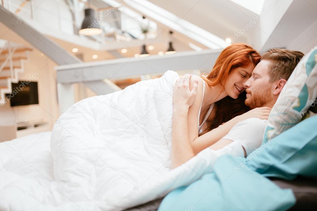 Beautiful couple romance in bed Stock Photo by ©nd3000 105599930