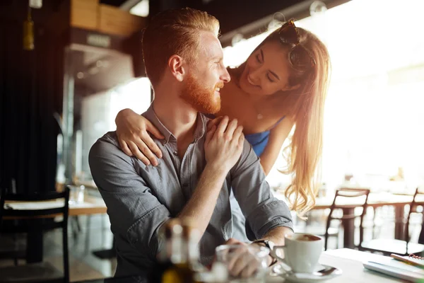 Beautiful man and woman in cafe — Stock Photo, Image