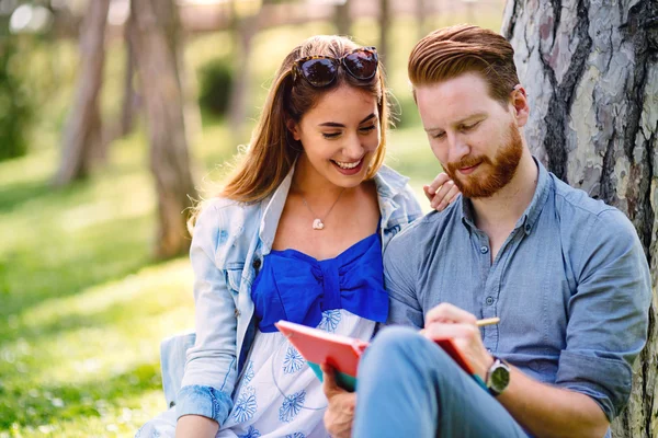 Beautiful college students flirting — Stock Photo, Image