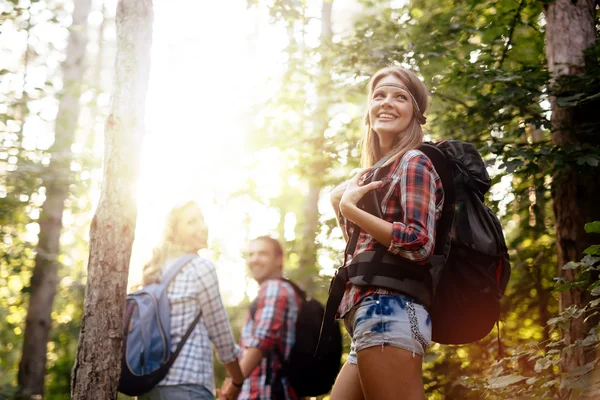 People trekking in forest — Stock Photo, Image