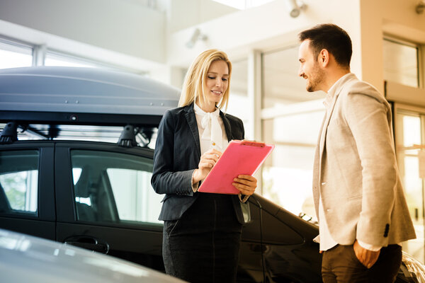 Customer looking at cars at dealership