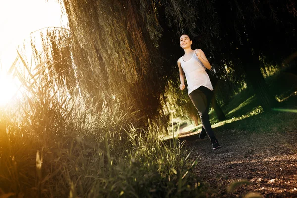 Athletic woman jogging — Stock Photo, Image