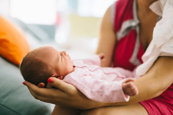 Mother holding newborn with joy — Stock Photo, Image