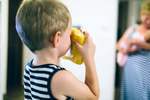 Cute boy becoming photographer — Stock Photo, Image