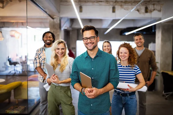 Successful group of business people, designers at work in office