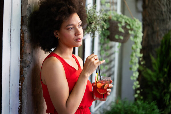 Portrait of black woman, model of fashion wearing dress with afro hairstyle