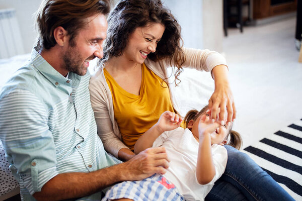 Happy smiling family having fun time at home