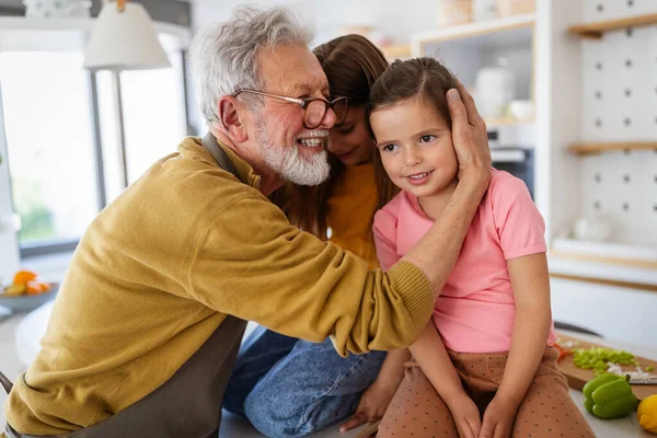 Family, generation and people concept. Happy grandparent having fun with children at home