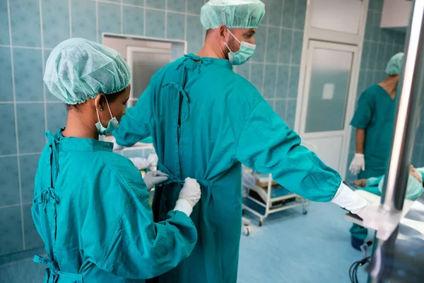 Group of exhausted surgeons at the emergency room as a sign of stress and overwork in hospital