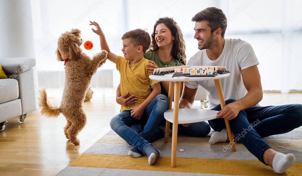 Happy young family having fun, playing together at home. Happy childhood concept