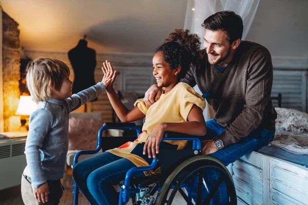 Happy Multiethnic Loving Family Smiling Little Girl Disability Wheelchair Home — Stock Photo, Image