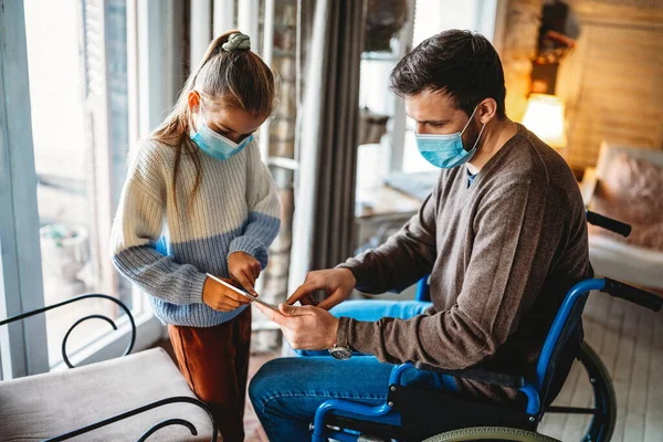 Father Disability Wheelchair Using Tablet Home Child While Wearing Masks — Stock Photo, Image