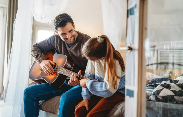Happy Girl Her Handsome Father Playing Guitar Smiling While Sitting — Stock Photo, Image