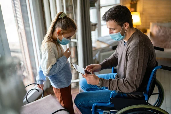 Father Disability Wheelchair Using Tablet Home Child While Wearing Masks — Stock Photo, Image