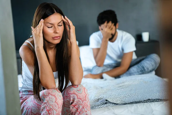 Couple having arguments and sexual problems in bed. Quarrel people concept