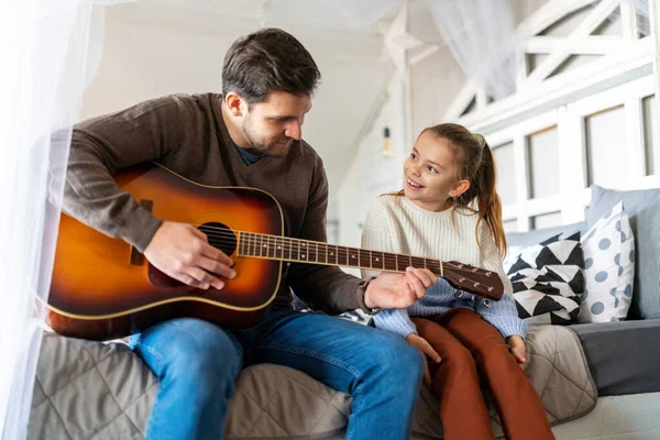 Happy Girl Her Handsome Father Playing Guitar Smiling While Sitting — Stock Photo, Image