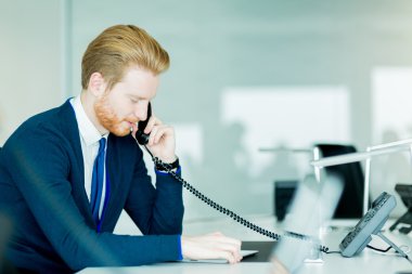 Male worker talking on a phone