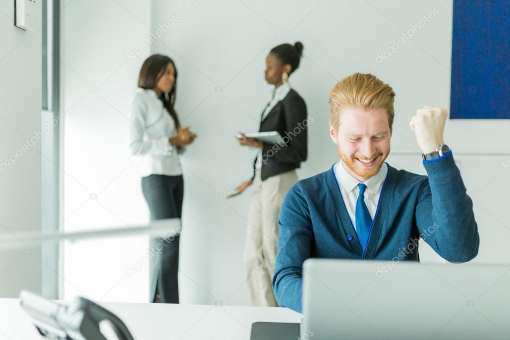 Successful businesman being happy for achieving his goals