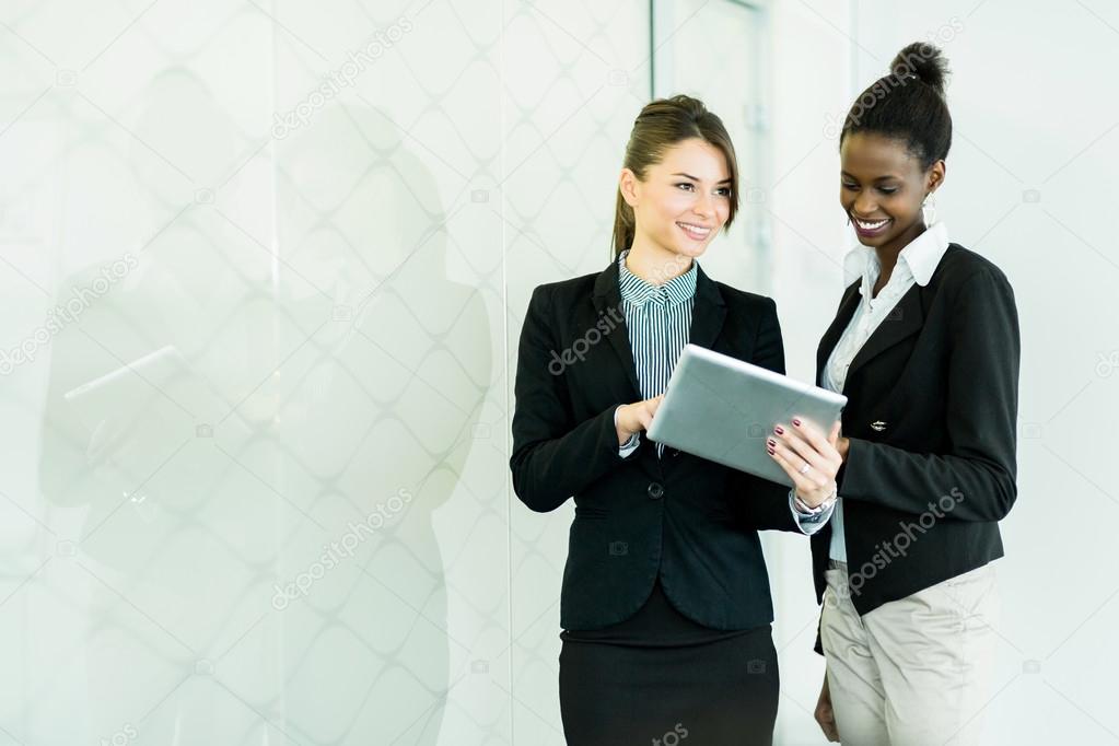 Businesswomen looking at a tablet