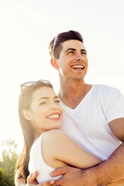 Beautiful couple hugging in summer — Stock Photo, Image