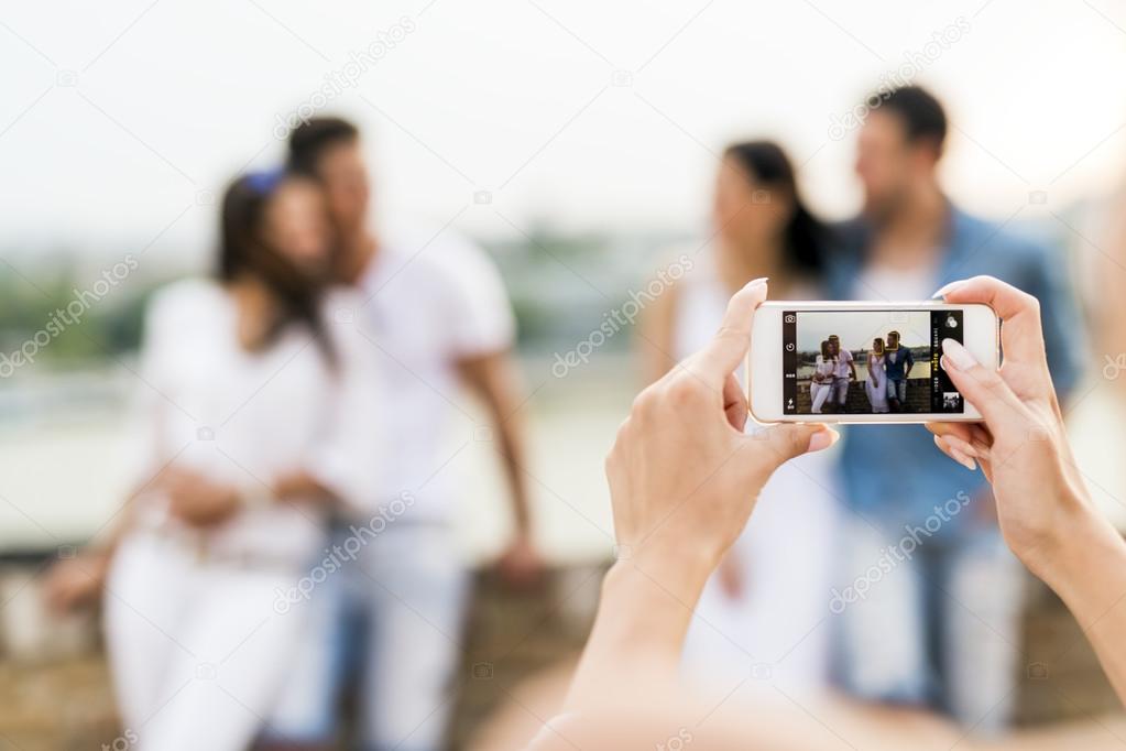 Group of young people being photographed