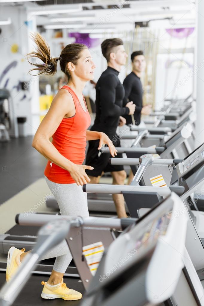 Group of people using treadmills