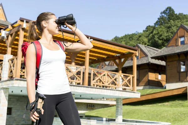 Tourist hiking and using binoculars — Stock Photo, Image