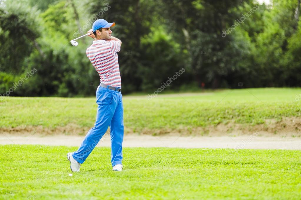 Golfer practicing and concentrating before and after shot during a nice sunny day