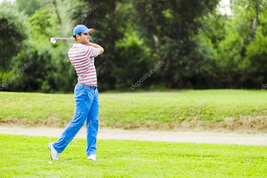 Golfer practicing and concentrating before and after shot during a nice sunny day