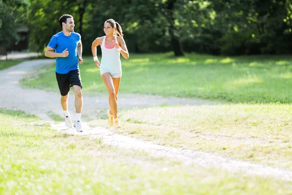 Young people running in nature — Stock Photo, Image