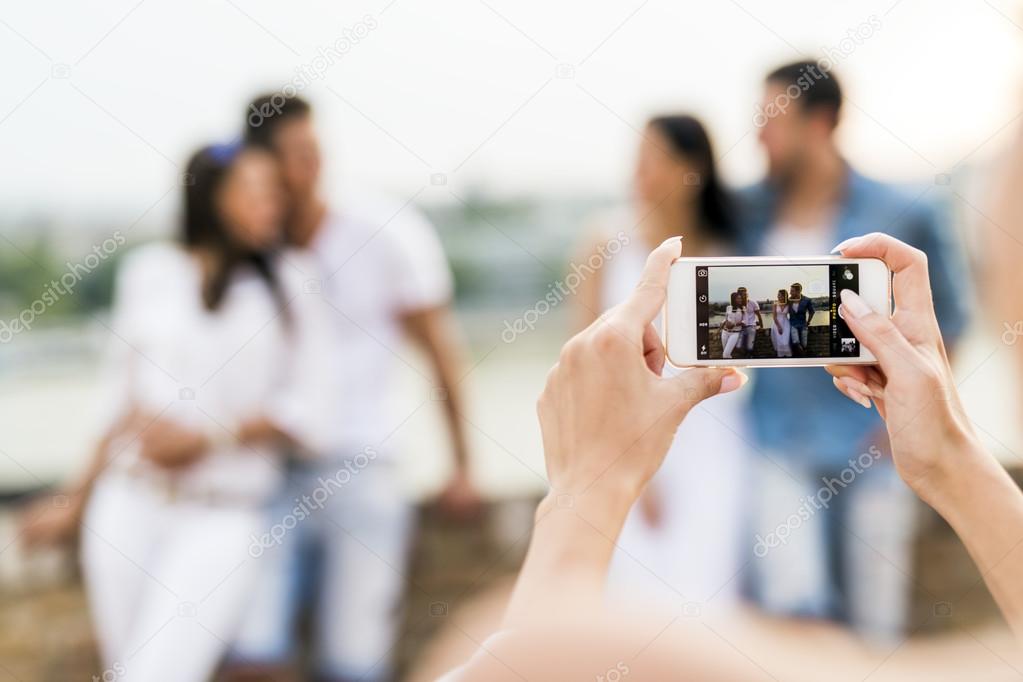 Group of young people being photographed