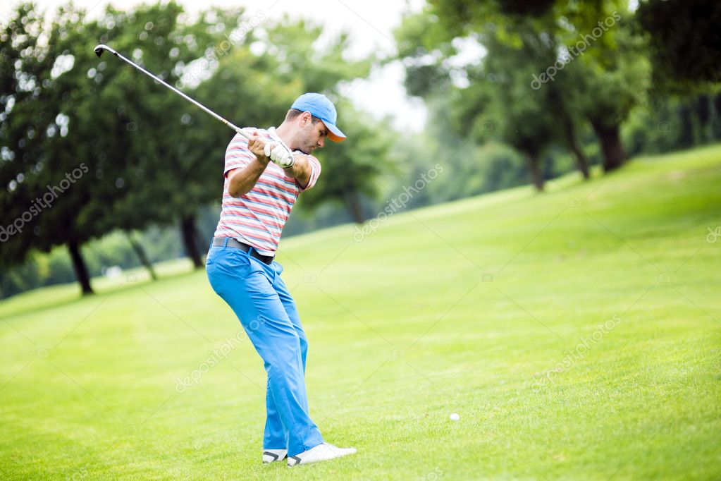 Golfer practicing and concentrating before and after shot during a nice sunny day