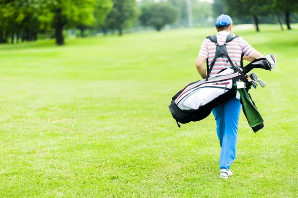 Golfer uitvoering zijn apparatuur — Stockfoto