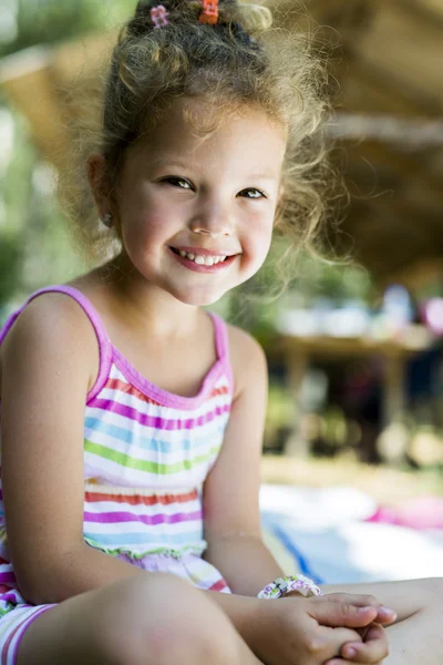 Beautiful curly haired girl smiling — Stock Photo, Image