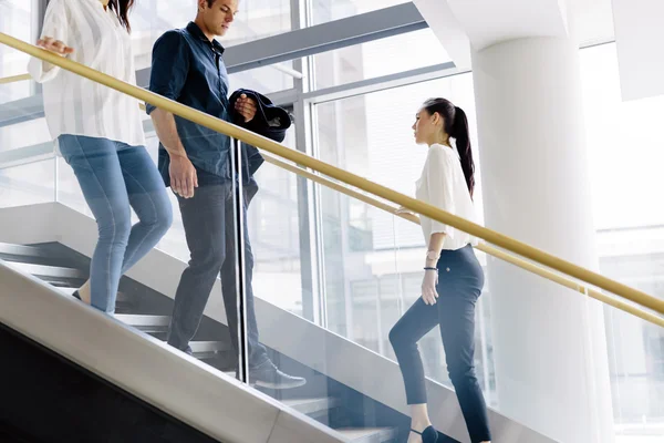 Group of businesspeople on stairs — Stock Photo, Image