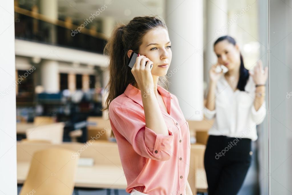 Beautiful women using phones