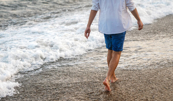 Young man searching for purpose and new horizons on a bright summer day, symbolizing freedom, life journey, ambition, optimism and the spirit of discovery