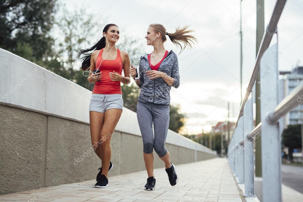 Beautiful scenery of two female joggers
