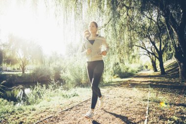 Fit woman jogging in nature