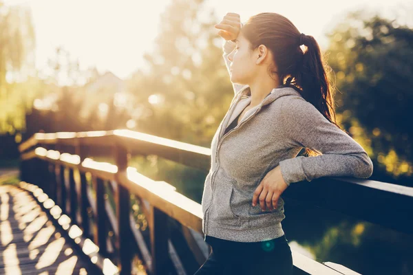 Beautiful female tired after jogging — Stock Photo, Image