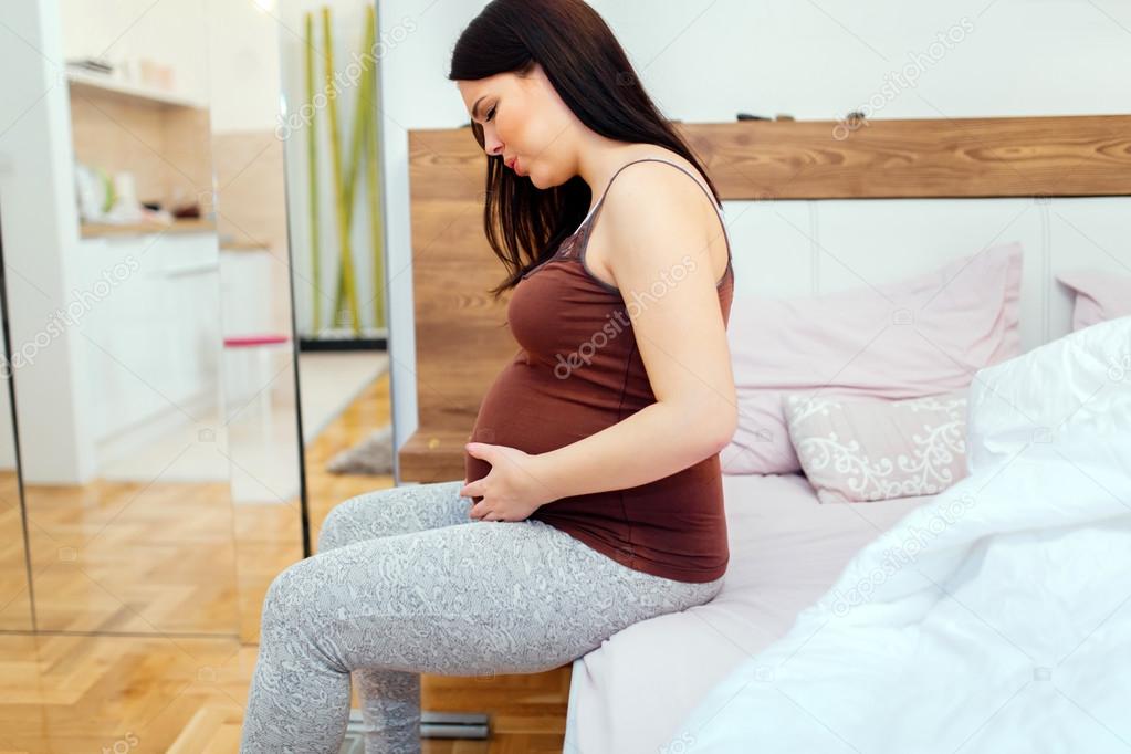 Pregnant woman having belly ache