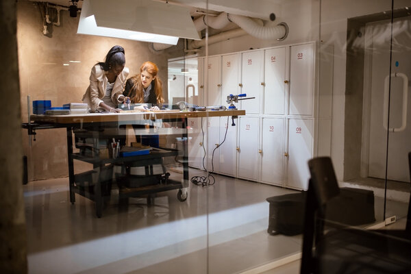 People working in modern workshop