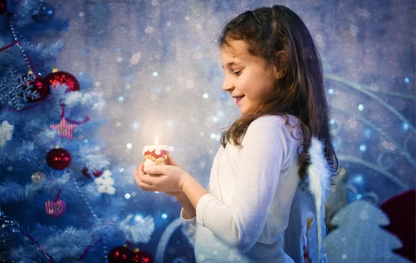 Girl-angel with a burning candle — Stock Photo, Image