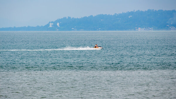 Scooter and boat on the water, Black Sea, Batumi, Georgia