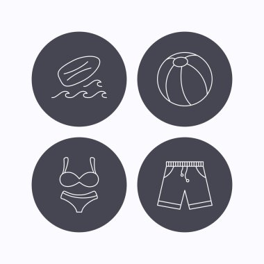 Sörf tahtası, plaj topu ve gövdeleri simgeler.