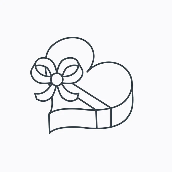 Icône boîte cadeau amour. Coeur avec signe d'arc . — Image vectorielle