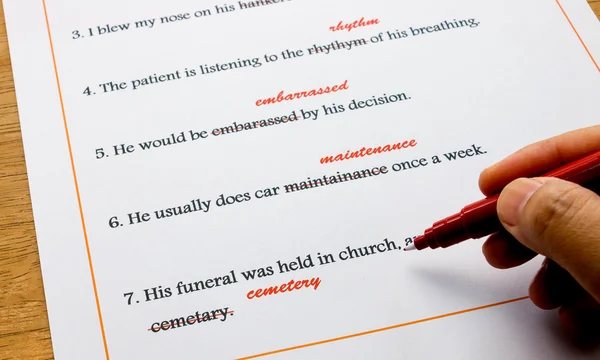 English spelling correction sheet on table — Stock Photo, Image