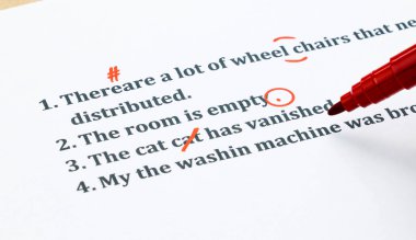english sentences and correcting symbols on white sheet clipart