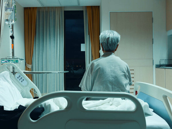NAKHON RATCHASIMA, THAILAND- July 4, 2021: senior asian woman sitting on bed in hospital for recovering her health